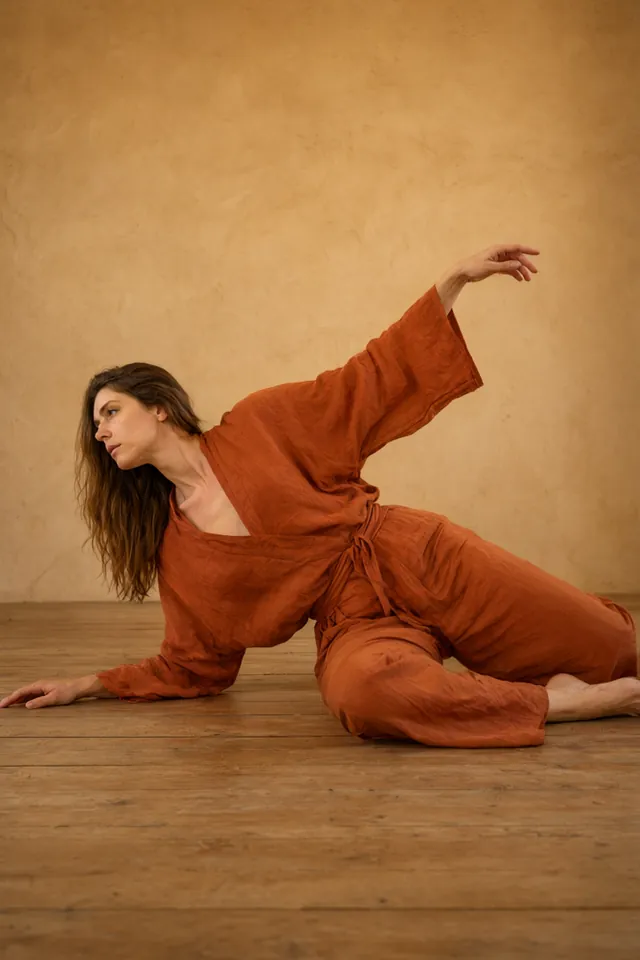 Dancer in floorwork on a wooden floor
